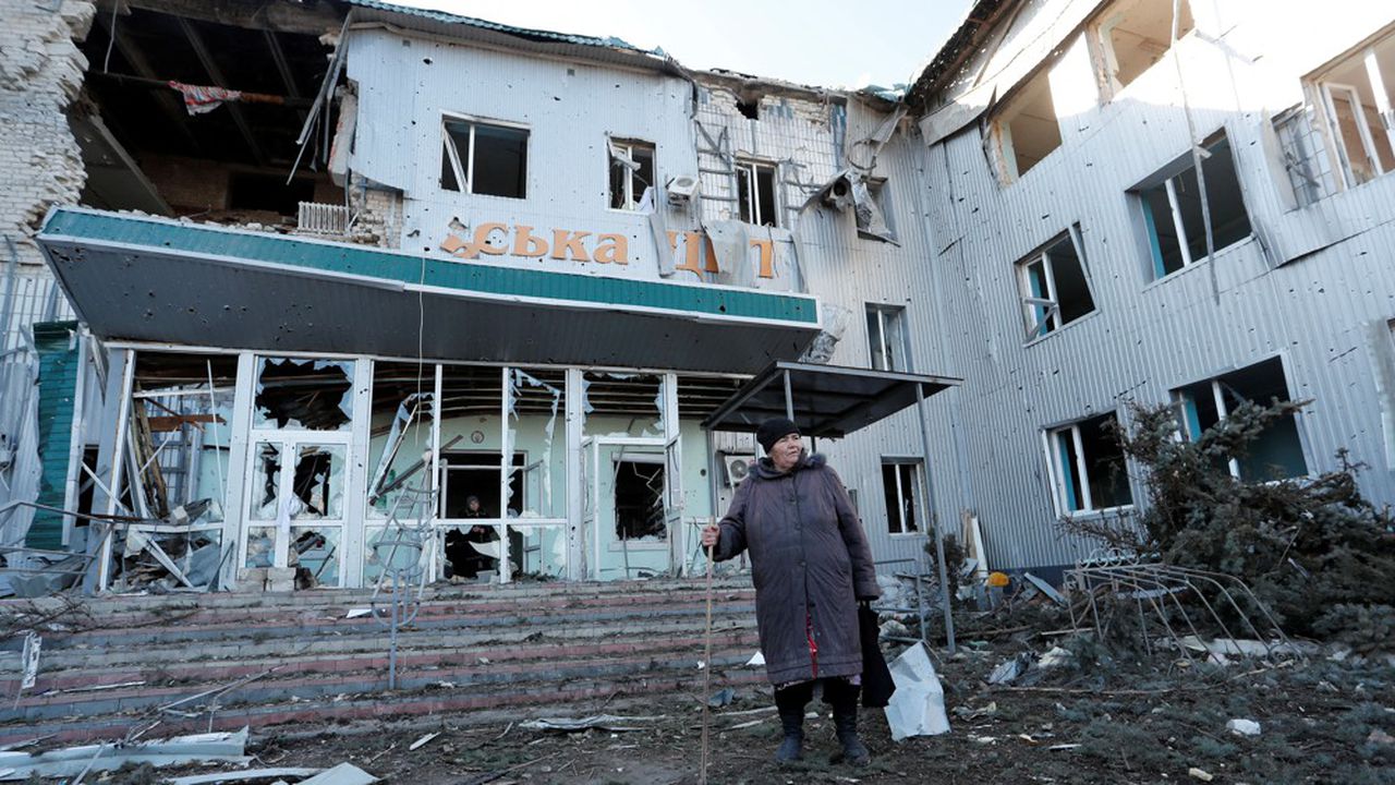 A woman stands outside a local hospital, which was destroyed during Ukraine-Russia conflict in the separatist-controlled town of Volnovakha in the Donetsk region, Ukraine March 12, 2022. REUTERS/Alexander Ermochenko TPX IMAGES OF THE DAY
